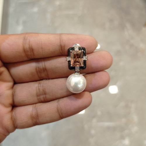 pearl earrings in rhodo coloured stone